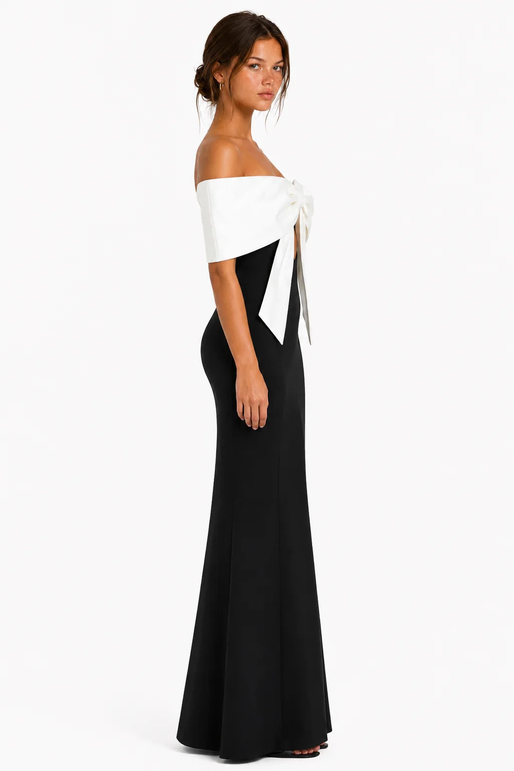 Side view of black off-shoulder bow bandage maxi dress