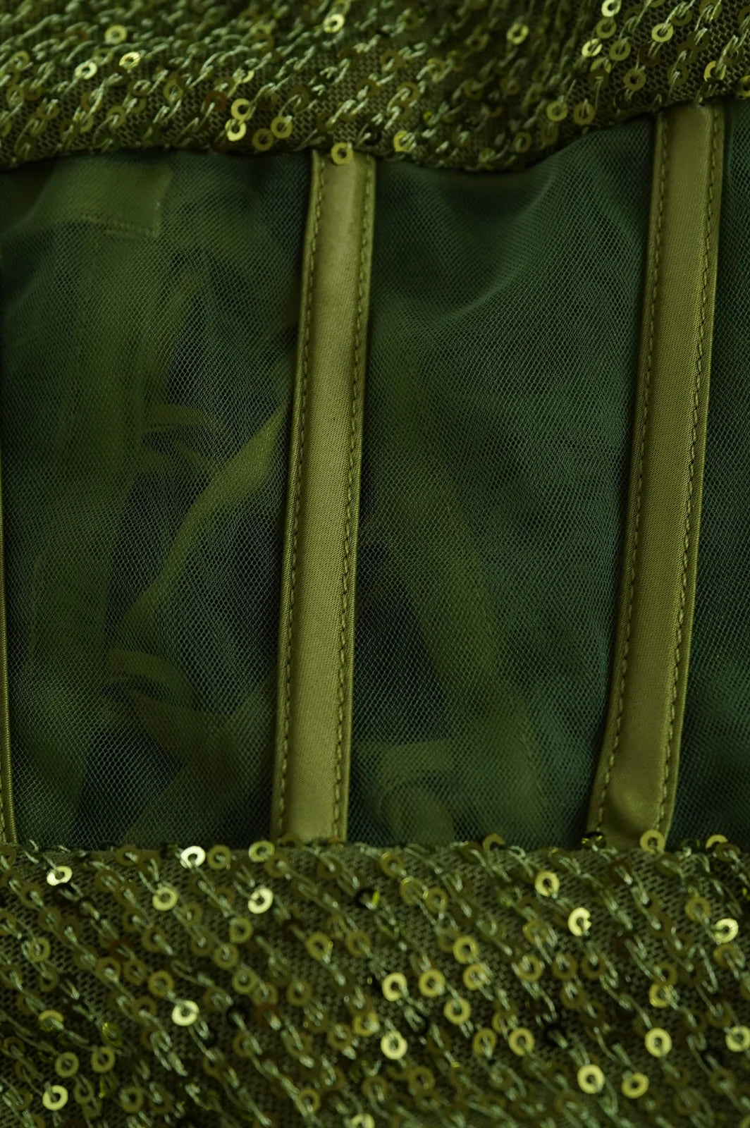 Back lacing detail of olive green strapless corset mini dress