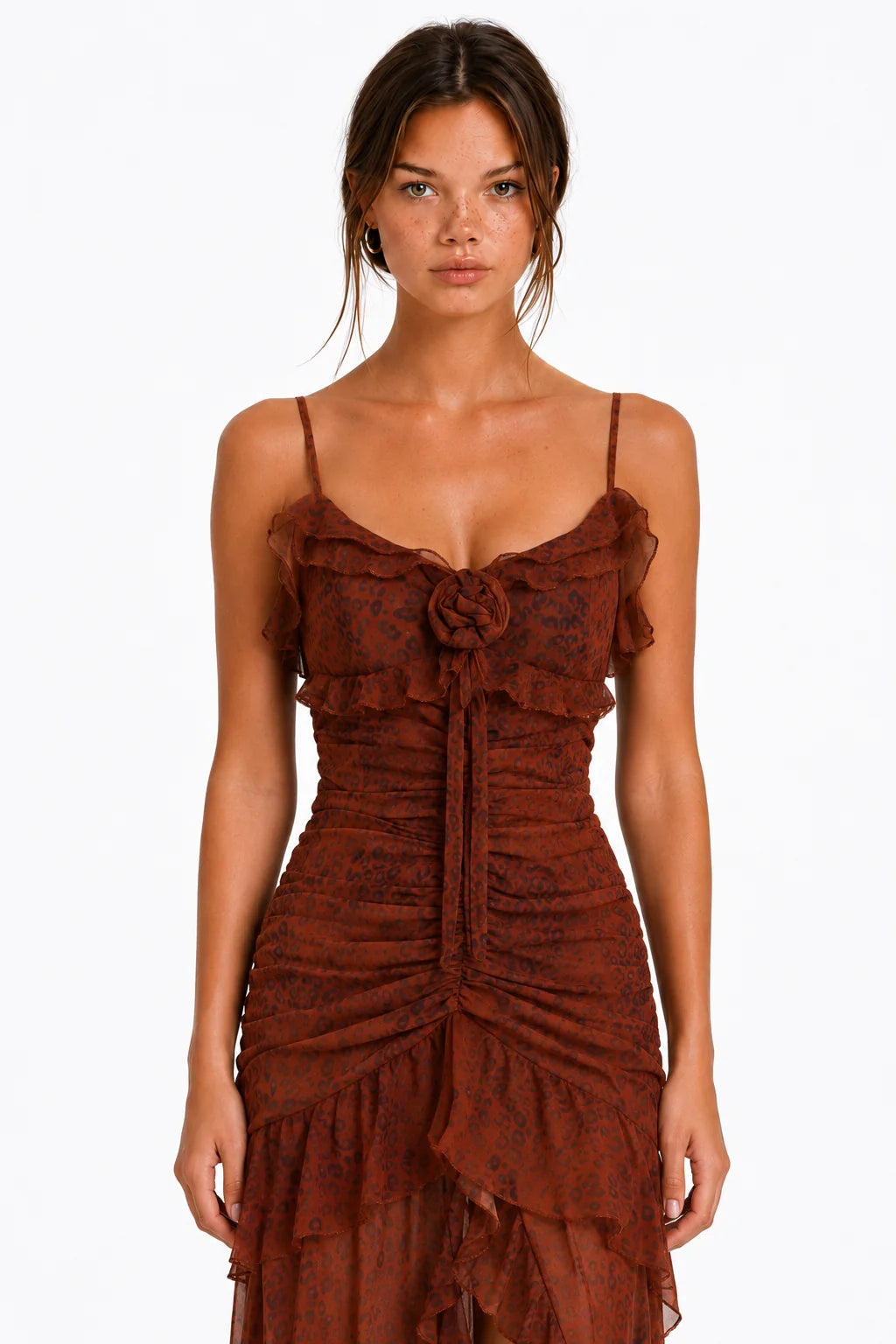 Close-up of rosette and ruffle detail on rust leopard print maxi dress