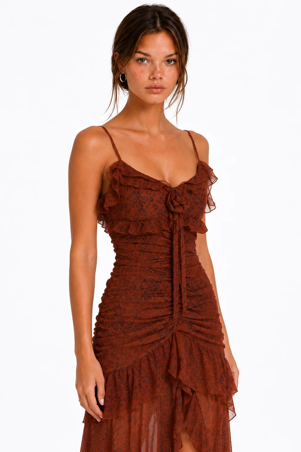 Detail view of ruched skirt and high slit on rust leopard print maxi dress